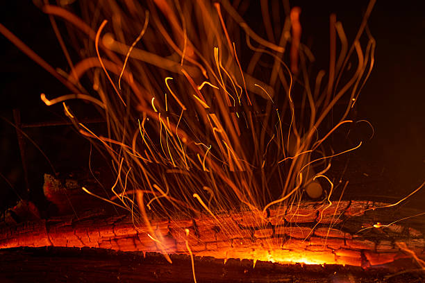 The trail of sparks flying from a bonfire. A depiction of raw energy.