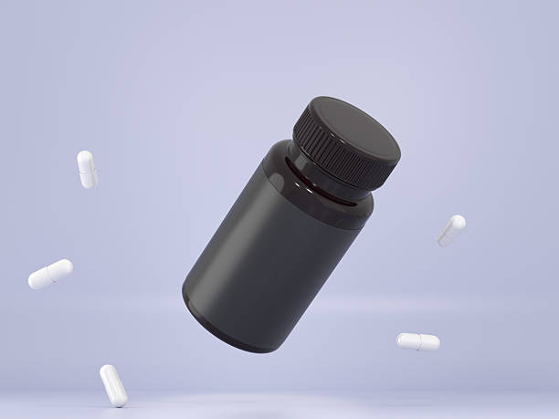 istock Supplement Vitamin pill black bottle with capsules 3D render 2245584308