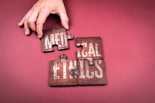 istock Medical Ethics Concept with Puzzle Pieces and Hand on Red Background 2245589042