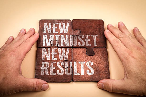 istock New Mindset New Results Concept with Puzzle Pieces and Hands 2245589048