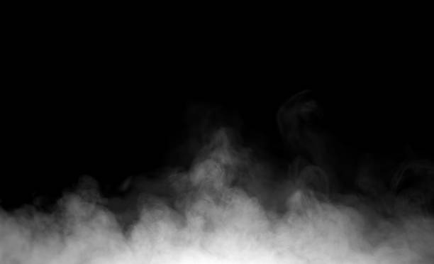 istock White smoke or fog texture on black background, creating a mysterious and dramatic atmosphere. Perfect for design overlays, fire effects, or abstract backgrounds in digital artwork. 2245596729