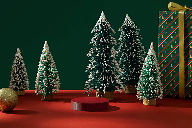 istock Winter forest composition with red podium and gift boxes. Calm Christmas atmosphere ideal for showcasing seasonal products or designs. Christmas podium 2245600332