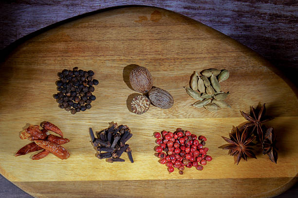 istock Aromatic spices on wooden cutting board for cooking 2245603387