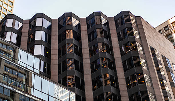 istock Business city. City architecture. Modern glass building. Reflective glass architecture. Architecture business district. Building architecture. Business building. Glass building. Urban business core 2245608564