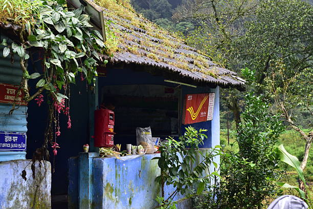 Valparai, Tamilnadu, India - September 28, 2025: A small remote hillside India Post office surrounded by lush greenery in Chinnakallar, known for its tea plantation and landscapes