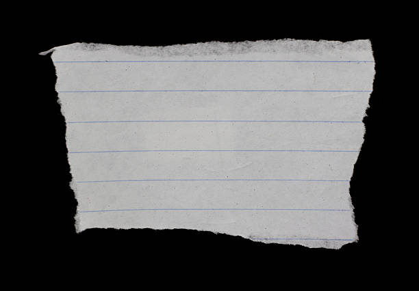 istock torn ripped paper on black background. 2245610734