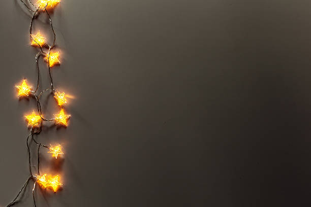 istock Bright star-shaped lights create a warm atmosphere on a dark background 2245612837