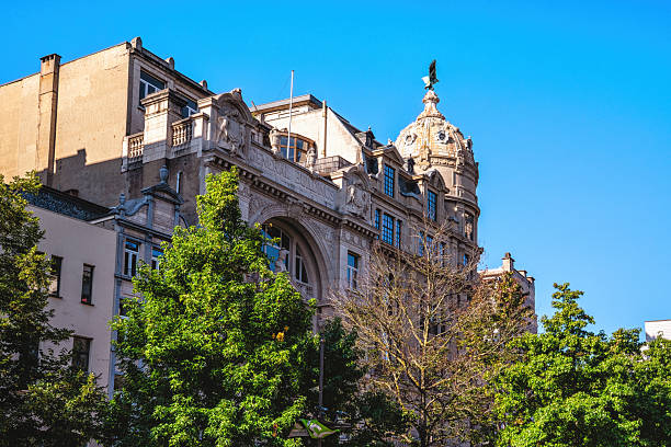 A pedestrian's perspective of buildings and sky in downtown New York City.