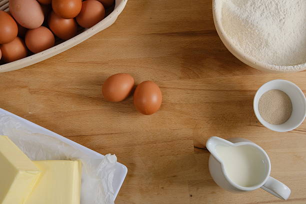 Elevated view of fresh, brown eggs on wooden table