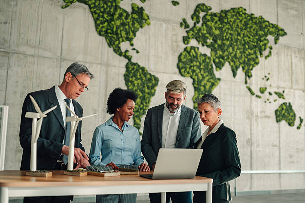 istock Business team discussing renewable energy projects in office 2245618503