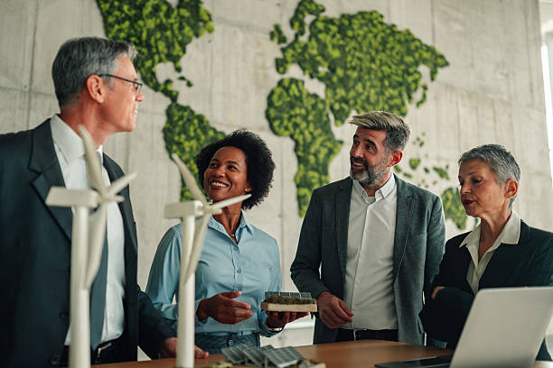 istock Business professionals discussing renewable energy solutions in office 2245618513
