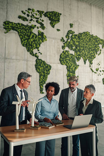 istock Business professionals discussing renewable energy solutions in modern office 2245618526