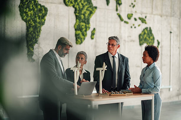 istock Business team discussing renewable energy project in office 2245618531