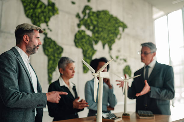 istock Business team discussing renewable energy project in office 2245618536