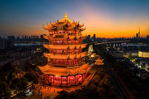 istock Illuminated Yellow Crane Tower at Sunset 2245621673