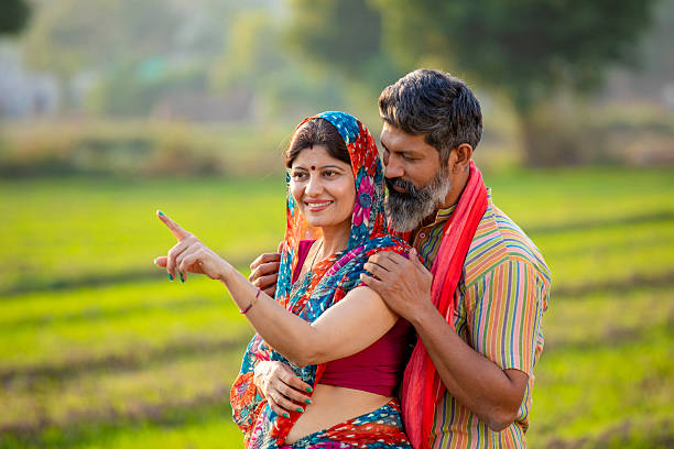istock Indian farmer couple giving expression at agriculture field. 2245626195