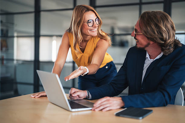 istock Business colleagues communicating and collaborating in an office 2245628382