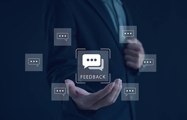 istock Business feedback and communication concept with digital chat icons floating around businessman's hand, representing online review, customer response, user engagement in corporate marketing strategy. 2245629669