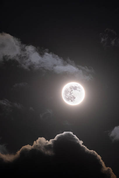 istock Full Beaver Super Moon - November's super full moon as it rose above clouds 2245629720
