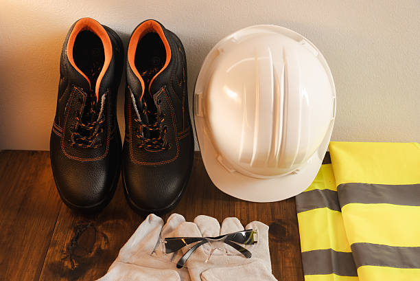 istock Personal protective equipment on wooden surface ensuring workplace safety and worker protection 2245632201