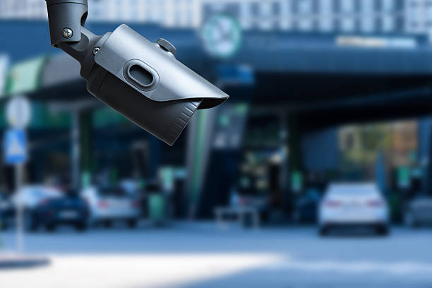 istock closeup on security CCTV camera or surveillance system in service station. 2245633380