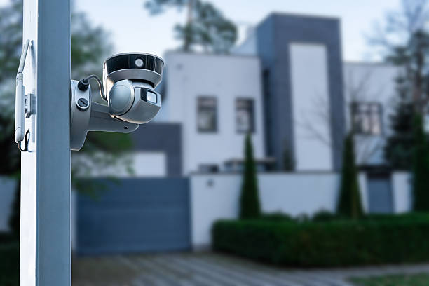 istock Security camera and private house on the background. 2245633381