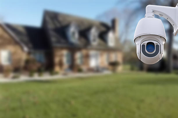 istock Security camera and private house on the background. 2245633391