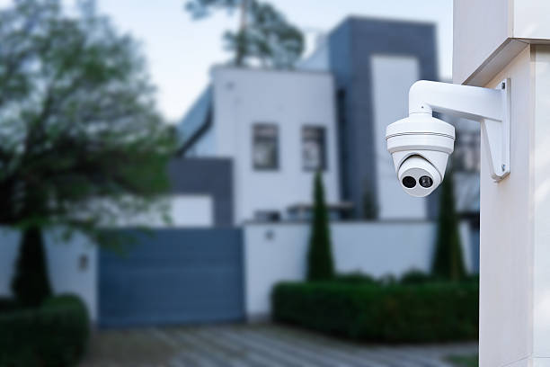 istock Security camera and private house on the background. 2245633658