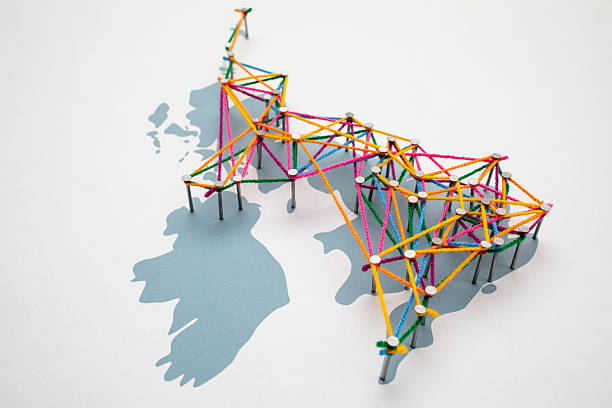 Connection concept: UK cities and towns connected together, randomly linked with wool of differing colours tied to nails.