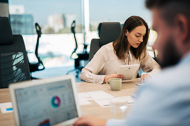 istock Business colleagues collaborating on projects in modern office 2245636485