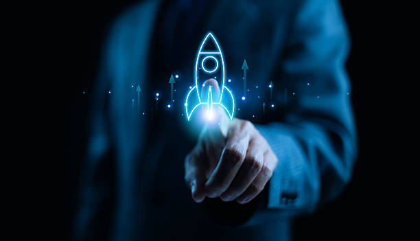 istock Businessman touching glowing digital rocket icon symbolizing startup launch, innovation, and business growth. Concept for digital transformation, success, technology, and futuristic entrepreneurship. 2245645747