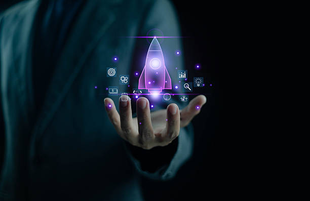 istock Businessman holding glowing digital rocket icon with startup and innovation technology concept, representing new business growth data analytics, future strategy, and successful digital transformation. 2245645748