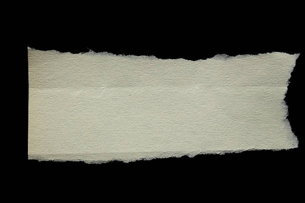 istock Torn paper piece isolated on black background 2245645815