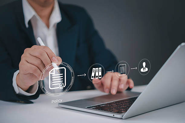 istock Businessman hands digital pen policy document workflow management laptop office compliance technology process data organization regulation system strategy innovation. 2245646417