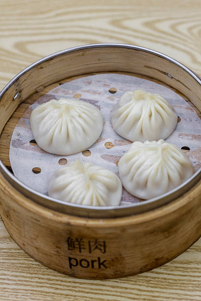 Four Delicious Pork Xiao Long Bao in Steamer