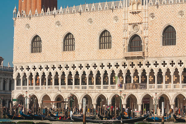 Venice, Italy - February 14, 2020: Doge's palace and gondolas on water, Venice, Italy.