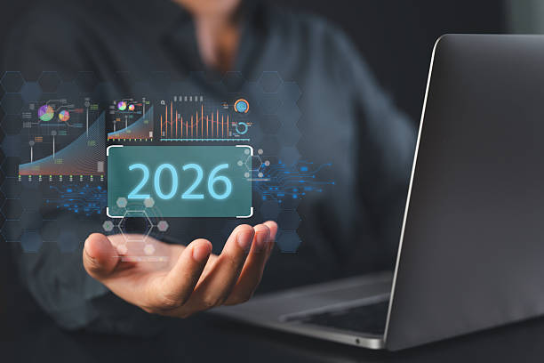 istock Businessman using laptop with holographic 2026 data analytics chart showing future financial technology innovation and digital economy transformation 2245661244