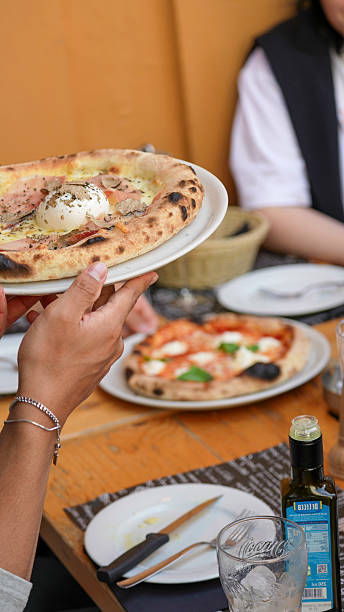 istock Italian style pizza on a plate at fine dining restaurant with warm and inviting presentation 2245667752