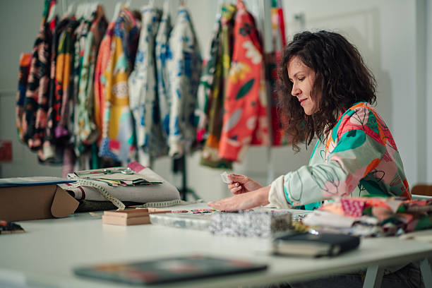 istock Female fashion designer working in her creative textile studio 2245673870