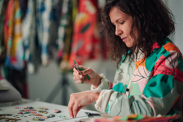 istock Woman creating handmade jewelry in her workshop 2245673965