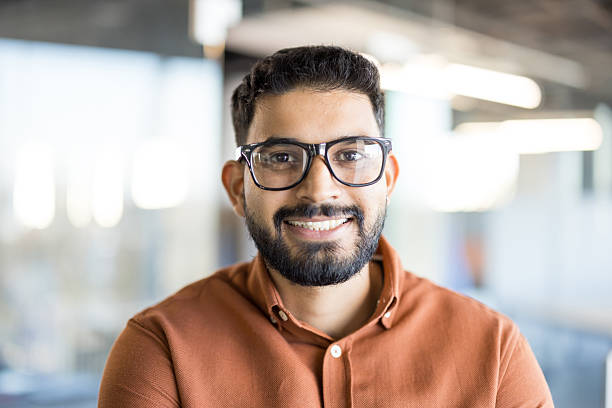 istock Smiling young indian man wearing glasses portrait 2245676448