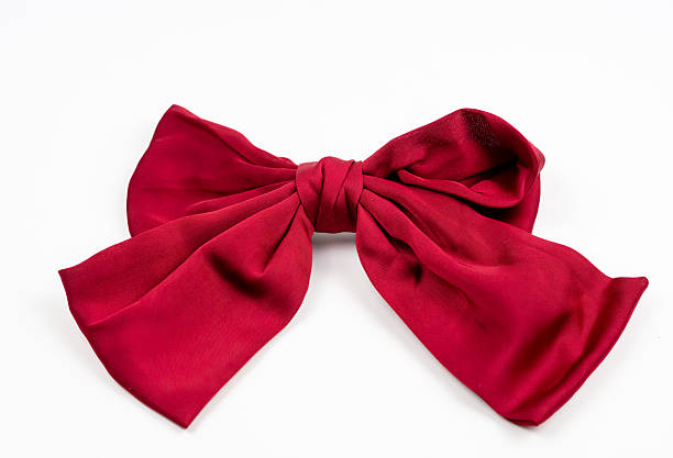 istock Red fabric bow on white background decorative textile holiday ornament 2245677959