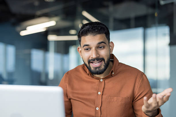 istock Young man having video call discussion in office 2245678003