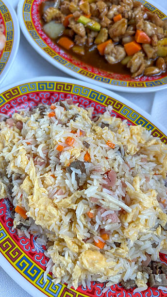 istock Tray of three delicacies rice and chicken with almonds 2245680426