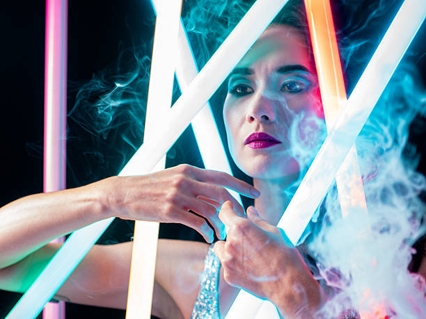 Stylish close-up of an Asian woman in neon glow. A creative visual with fashion tones and city nightlife mood.
