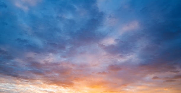 istock Sunset or sunrise. Dramatic majestic scenery sunset. Sky with clouds in sunset sky light background. Sunrise with clouds in various shapes. Calm sunset sky and sun through clouds over. 2245686167