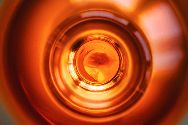 Glass bottle top macro view with bokeh lights