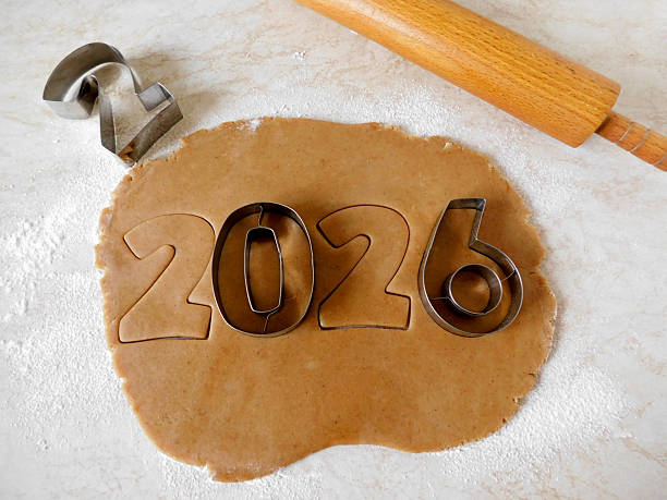 istock Gingerbread dough rolled out with metal number cutters forming “2026” 2245694896