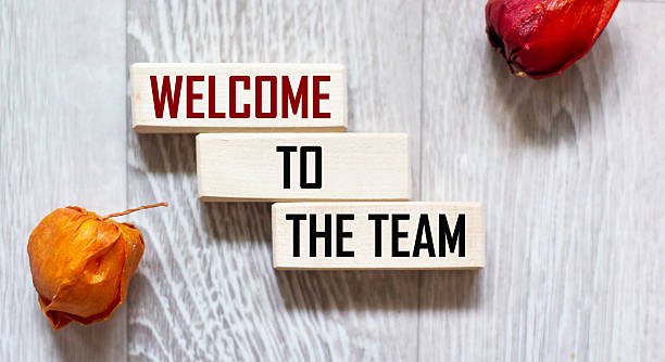istock Welcome to the team. Text on wooden blocks on a gray background 2245696755