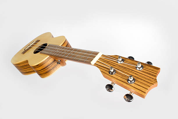 istock Ukulele made of light precious wood on a white background 2245698919